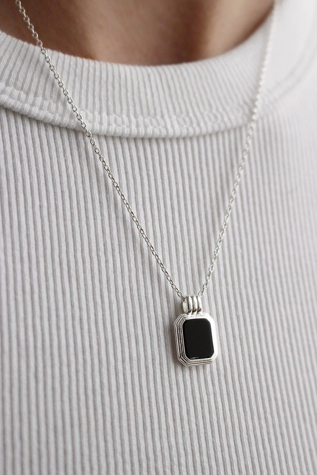 Silver necklace with black pendant deals
